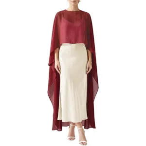 Elegant burgundy chiffon capelet paired with an ivory satin skirt, detail view of evening gown.