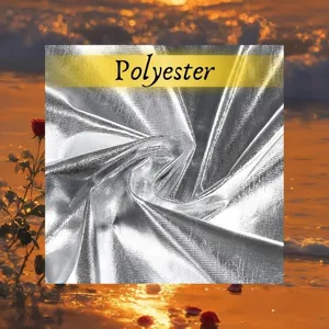 Silver metallic fabric detail, shiny polyester cloak material close-up view texture.