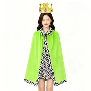 Green velvet costume cape with dalmatian print lining and golden crown detail for party.