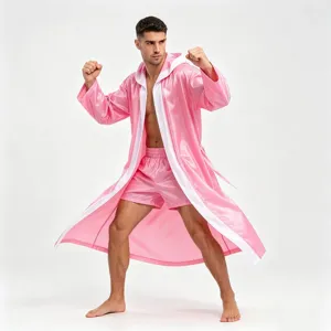 Pink boxing robe with hood and shorts for combat sports training and match entrance performance.