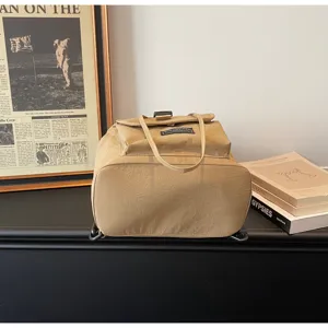 Minimalist solid color canvas drawstring backpack detail, casual daily commuter school bag.