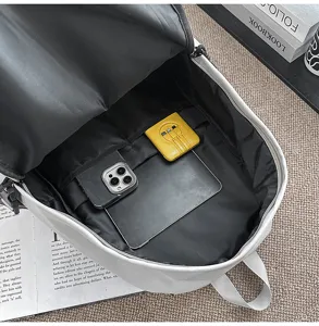 Grey tactical backpack interior detail showing large capacity and multi-layer pockets storage.