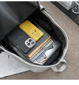 Large capacity utility style school backpack detail view showing internal storage space for students.