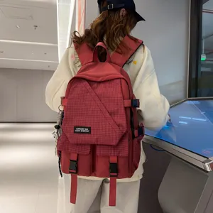 Workwear style student backpack with large capacity and grid pattern for daily casual travel use.
