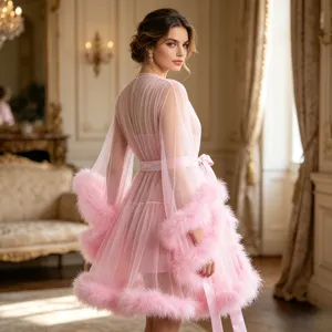 Pink sheer mesh dressing gown with feather trim, elegant nightwear detail view.