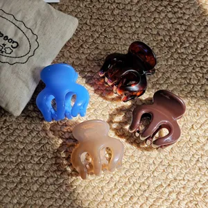 Closeup of multi-color resin hair claw clips set, featuring simple daily styling details.