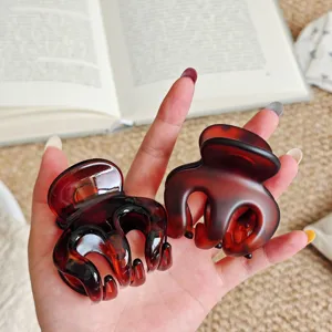 Tortoise shell hair claw detail view, perfect for daily styling and secure updo hairstyles.