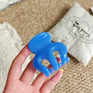 Blue hair claw clip detail shot, showing smooth resin texture and lovely octopus design.
