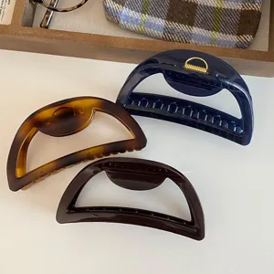 Korean vintage semi-circular hollow large hair claw clip set for thick hair styling and elegant buns.