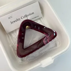 Minimalist dyed triangle hair claw clip for women, elegant acetate shark clip for daily wear.