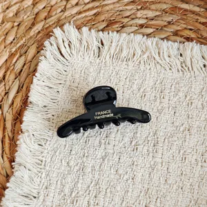 Elegant black acetate hair claw clip for women, perfect for daily styling and hair accessories.