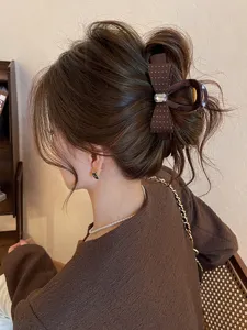 Pince à cheveux nœud avec strass, grand clip griffe à pois élégant pour coiffure tendance.