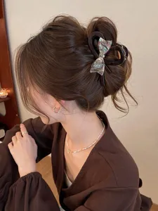 Elegant iridescent bow hair claw clip, large shark clip for chic updo hairstyles and daily wear.