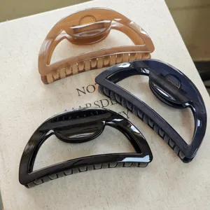 Oversized half-circle hair claw clip set, thick spring shark clips for elegant hair styling.