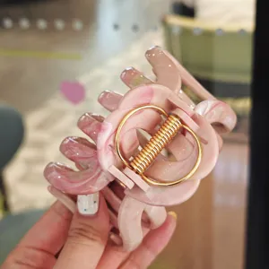 Pink marbled hair claw clip for women, large acetate shark clip with gold spring.