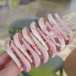 Pink marbled hair claw clip detail, large size hairpin for thick hair styling, elegant.