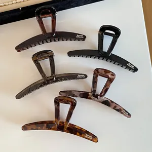 Set of 5 retro tortoise shell and leopard print hair claw clips for thick hair styling.