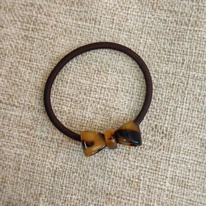 Elastico per capelli con fiocco in acetato donna, corda elastica resistente con tartaruga stile chic.