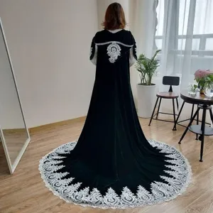 Black velvet hooded cloak with intricate lace embroidery and long dramatic hem for costume.