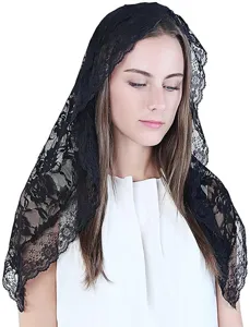 Detailed view of exquisite black lace chapel veil, delicate floral embroidery, elegant bridal accessory.