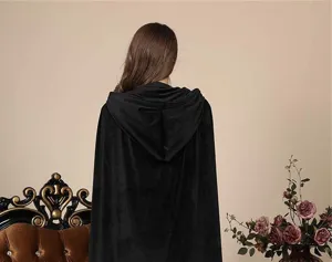 Detail view of a black velvet hooded cloak, back angle showcasing the elegant drape and design.