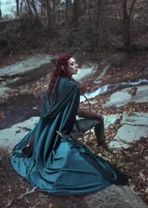 Detail view of the dark green velvet hooded cloak, perfect for winter costume and cosplay.