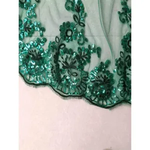 Green sequin lace embroidery trim detail close up view, elegant bridal fabric accessory.