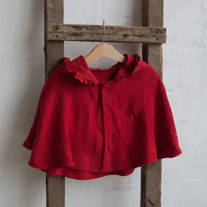 Kids red hooded cape detail, cute ruffle brim design, classic winter Christmas costume cloak.