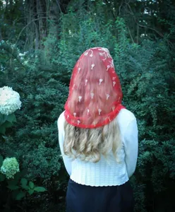 Detailed view of the elegant red mesh embroidered chapel veil, showing exquisite floral patterns.