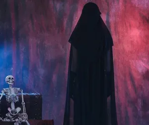 Halloween black hooded cloak detail view, mysterious gothic costume scene showcase