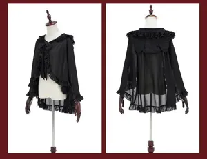 Close-up details of the black chiffon cape showing ruffle trims, delicate ties, and back hood.
