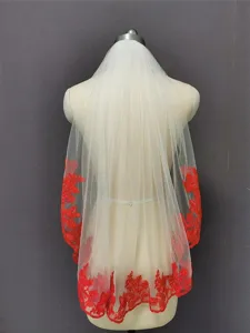 Ivory bridal veil with striking red lace embroidery, elegant mesh wedding hair accessory for women.