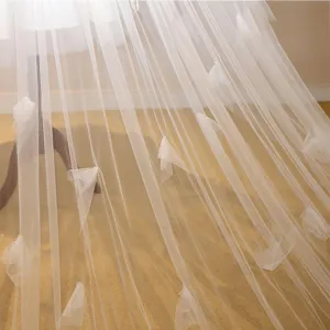 Elegant ivory long bridal wedding veil with delicate 3D floral appliques and flowing train.