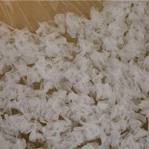 White ruffled tulle fabric detail close up for wedding veil or dress decoration texture