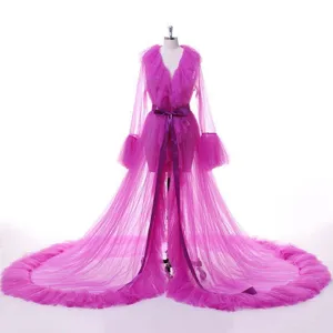 Pink mesh bridal cape with long sleeves and dramatic train for fashion show wedding dresses.