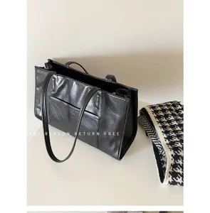 Korean style large capacity black leather tote bag, versatile casual shoulder bag for daily commuting.
