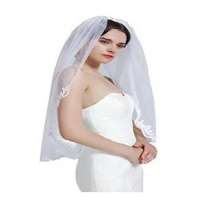 Elegant white bridal veil with delicate lace embroidery for wedding ceremony and bridal dress.