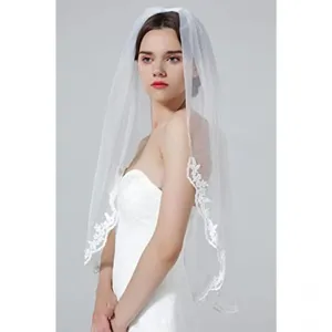 Elegant white bridal veil with delicate lace embroidery, wrist length with comb for wedding.