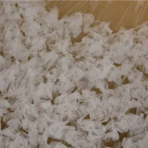 Elegant white wedding veil with delicate ruffled flower details, long tulle trailing design.