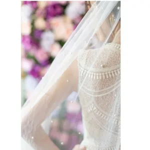 Stunning cathedral length bridal veil with delicate pearls for wedding photography and ceremonies.