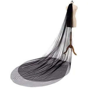 Detail shot of a black double layer long cathedral bridal veil with comb for wedding photography.