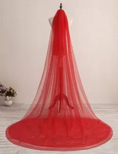 Detail view of a stunning long red bridal veil with dual layers and elegant mesh texture.