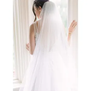 Elegant long white bridal wedding veil featuring double layers of sheer mesh for a stunning look.