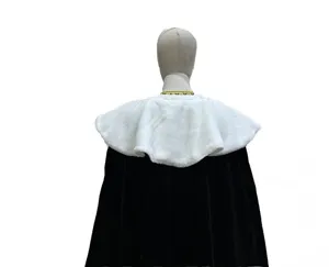 Close-up detail of the black and white costume cloak, soft faux fur collar texture.