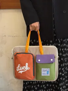 Stylish color-blocked laptop tote bag for women, large capacity casual shoulder bag.