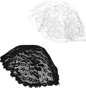 Close up detail view of the elegant floral lace pattern on the black and white headscarf.