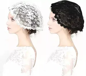 Close-up detail of the elegant floral lace bridal headscarf and veil in white and black.