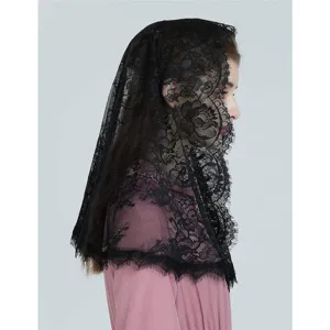 Detailed side view of a black floral lace mantilla veil, showing delicate edge embroidery texture.