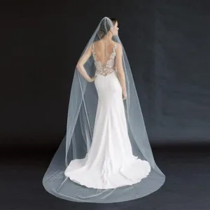 Long white bridal veil with comb, elegant wedding accessory for stunning bridal photography.