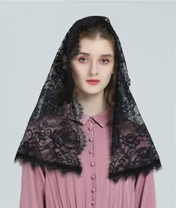 Close-up view of black lace mantilla veil, intricate floral pattern and delicate fringe trim.